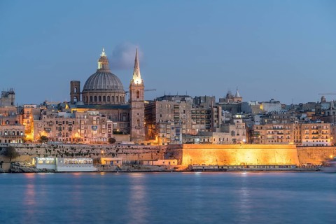 City view with St. Paul's Pro Cathedral and Carmelite Church at dusk