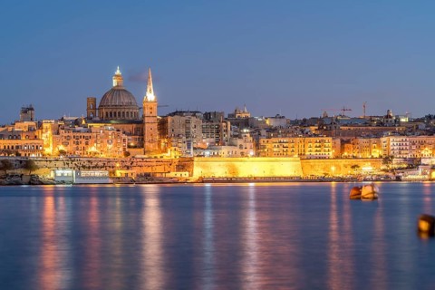 City view with St. Paul's Pro Cathedral and Carmelite Church at dusk