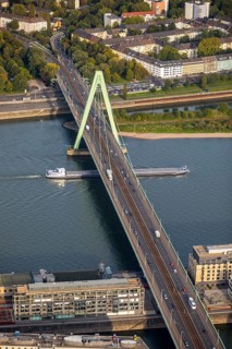Severinsbrucke with Rhine and cargo ship