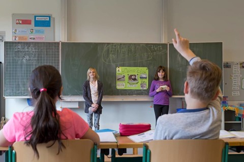 Students giving a presentation about Marco Polo