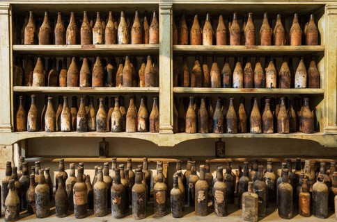 Showroom with old dust covered sherry bottles