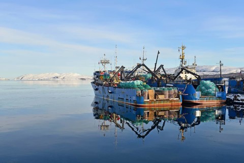 Rusty Russian fishing boats in harbor