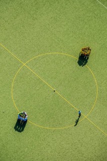 Football players at the center circle