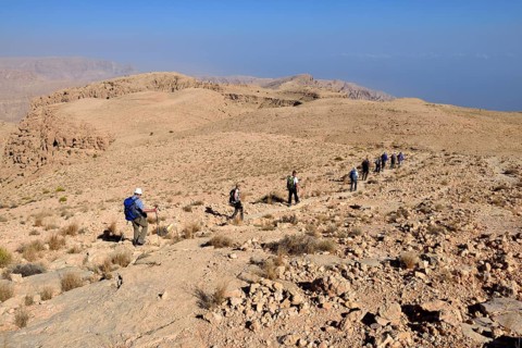 Tourists hiking above Wadi Tiwi