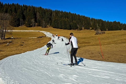 Cross country skiers on artificial snow trail
