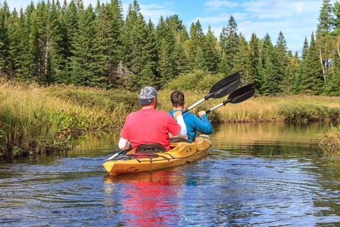 Two men paddling in a kayak