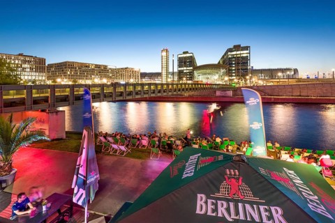 Beach bar Capital Beach at dusk at the river Spree opposite central railway station
