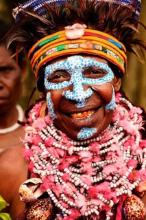 Woman of the Marowa Welda group applying make-up for the annual Sing Sing in Goroka