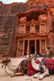 Dromedaries in front of the Pharaoh's treasure house carved out of rock