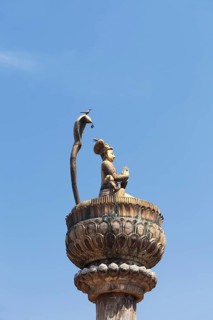 Statue of king Yoganarendra Malla with snake and bird