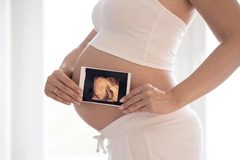 Woman in her ninth month pregnant