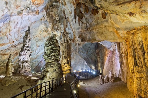 Boardwalk through illuminated dripstone cave