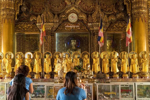 Praying Buddhists in the Sule Pagoda