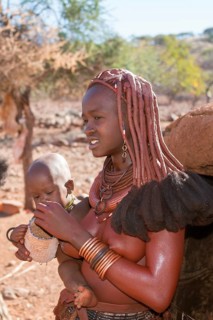 Himba woman with baby in arms