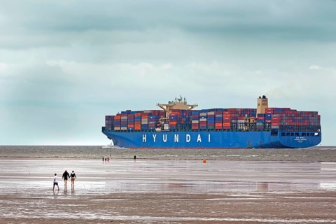 Container ship in channel