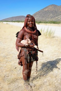 Himba woman with small goat