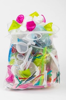 Garbage bag filled with disposable crockery