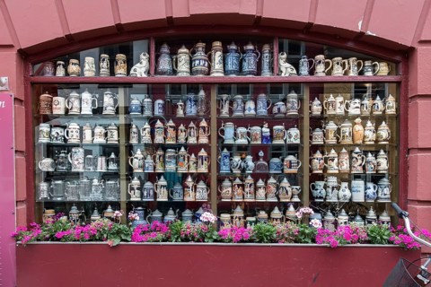 Collection of steins in window of restaurant Kobenhavneren in Helsingor