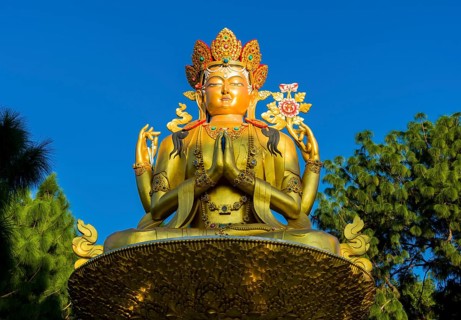 Big golden statue of Maitreya Buddha at back of Swayambhunath temple