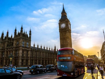 Red double decker bus in front of Big Ben