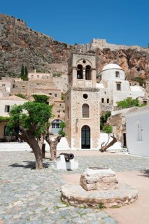 Main square with bell tower of the Byzantine Greek Orthodox church Christos Elkomenos