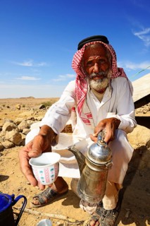 Bedouin preparing coffee with pan-roasted beans and kardamom