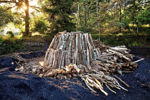 Charcoal pile with logs