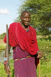 Male Maasai in traditional Shuka clothing with spear