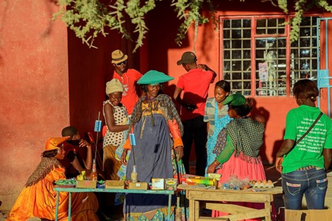 Locals in colorful clothes at a stall