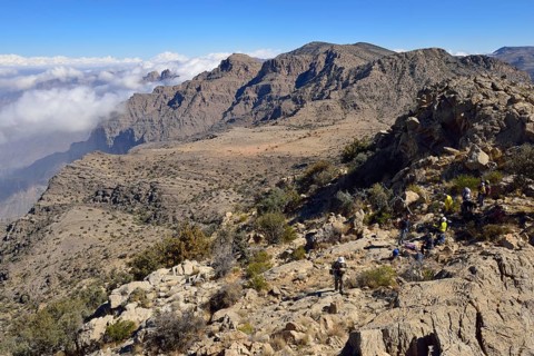 Tourists hiking in the Al Hajar al Gharbi mountains