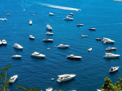 Motorboats anchor in the bay of Lacco Ameno
