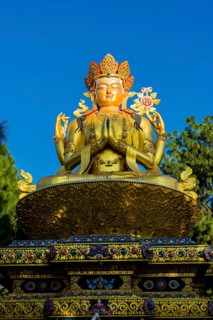 Big golden statue of Maitreya Buddha at back of Swayambhunath temple