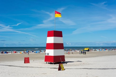 Guarded beach marked by flags