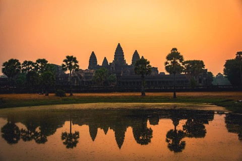 Temple complex of Angkor Wat reflected in the water basin