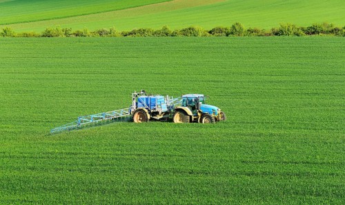 Tractor with field sprayer