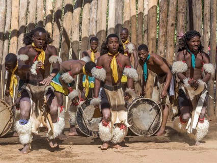 Men in traditional clothing during dance performance