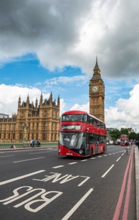 Red double-decker bus on the Westminster Bridge