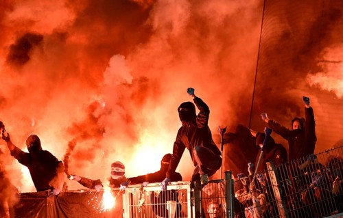 Masked football fans rampage