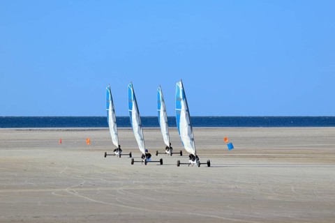 Sand sailors ride on the beach