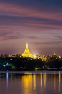 Illuminated Shwedagon Pagoda at sunset