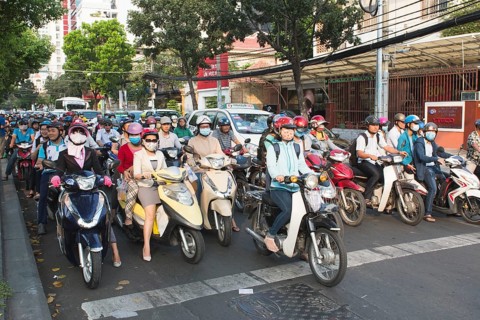 Many mopeds on the road