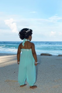 Little Maldivian girl on the sandy beach