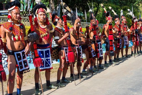 Naga tribal group performers standing in line to welcome the officials at the Hornbill Festival