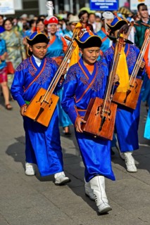 Youth in traditional Deel clothes and horse-head fiddle