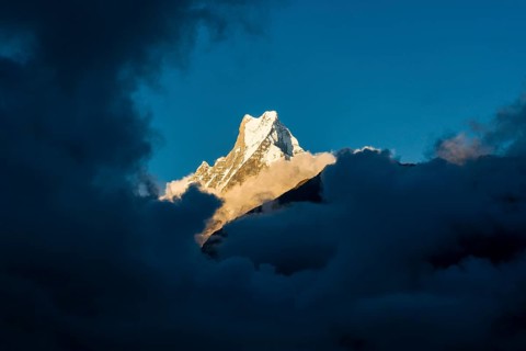 View on the summit of the mountain Machapuchare at sunset