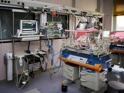 Incubator with newborn baby