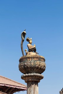 Statue of king Yoganarendra Malla with snake and bird