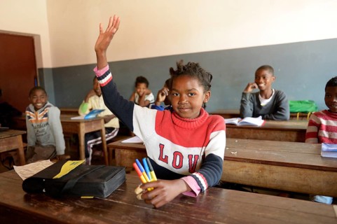 Girl with raised hand