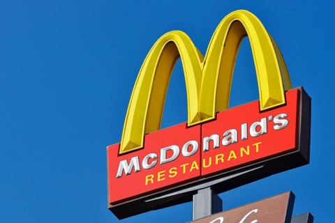 McDonalds sign against a blue sky