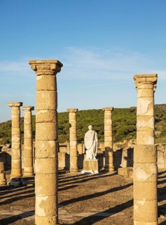 Ruins with statue of emperor Trajano